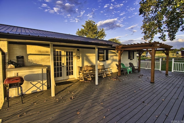 deck with a grill, a pergola, and french doors