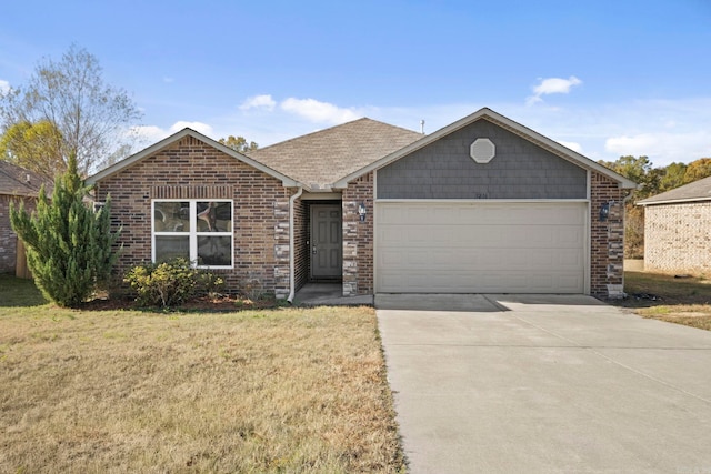 ranch-style house featuring a garage and a front lawn