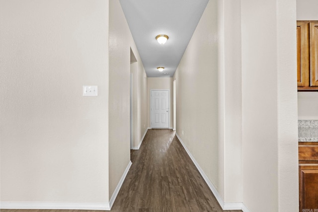 hall with dark hardwood / wood-style floors