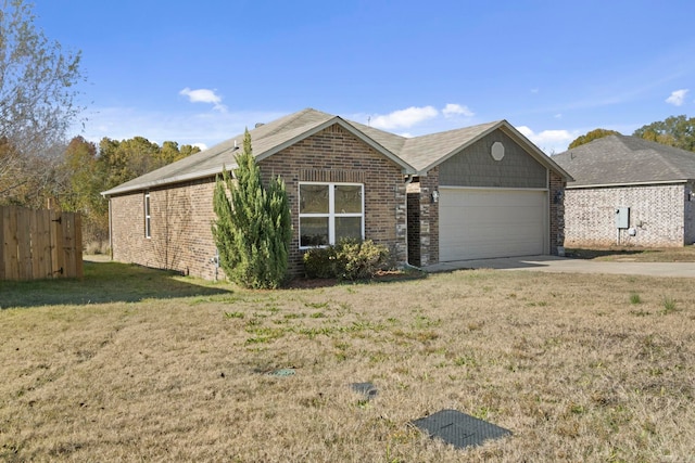 view of front of home with a garage and a front lawn