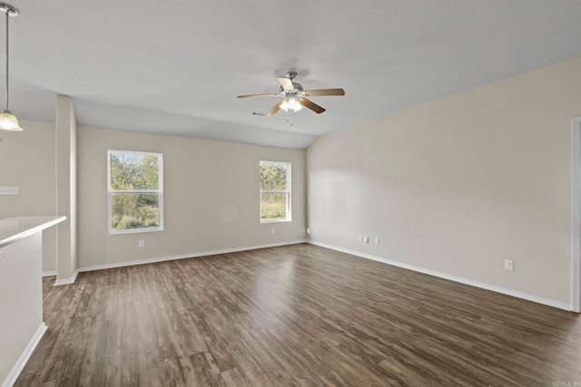 unfurnished living room with a textured ceiling, dark hardwood / wood-style flooring, and ceiling fan