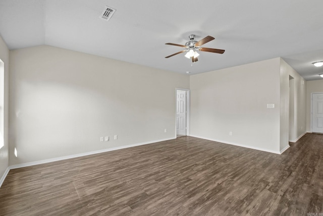 empty room with ceiling fan, dark wood-type flooring, and lofted ceiling