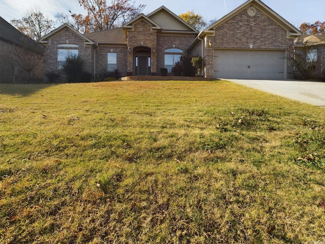 single story home featuring a front lawn and a garage