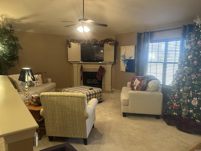 carpeted living room with ceiling fan