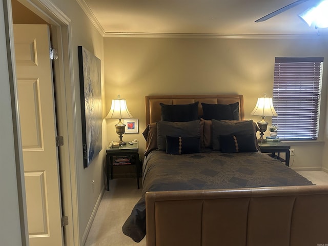 bedroom with carpet flooring, ceiling fan, and crown molding