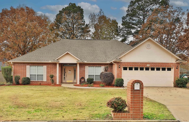 single story home featuring a garage and a front lawn