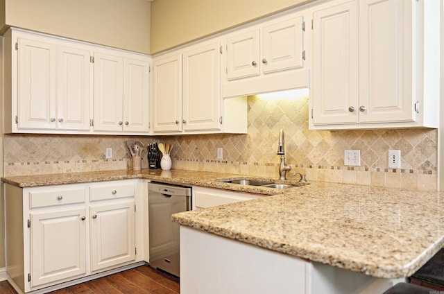 kitchen with dark hardwood / wood-style flooring, dishwasher, white cabinets, and sink