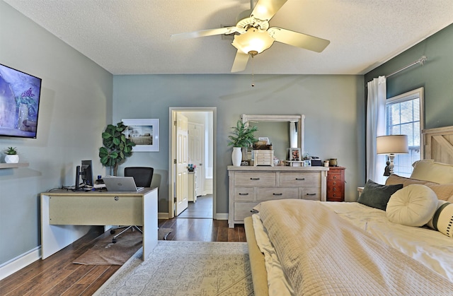 bedroom featuring a textured ceiling, dark hardwood / wood-style floors, and ceiling fan