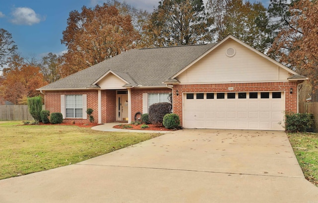 ranch-style home featuring a front lawn and a garage