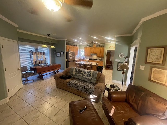 living room with crown molding, billiards, light tile patterned floors, and ceiling fan