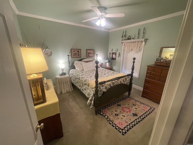 carpeted bedroom with ceiling fan and crown molding