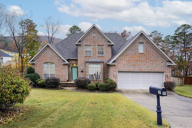 view of front facade featuring a garage and a front lawn