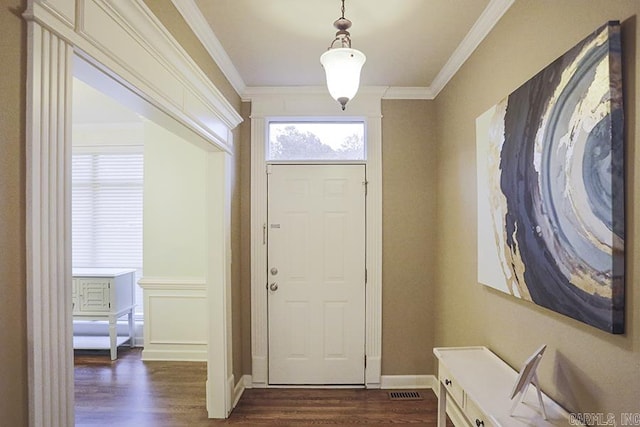 entryway featuring dark hardwood / wood-style flooring and ornamental molding