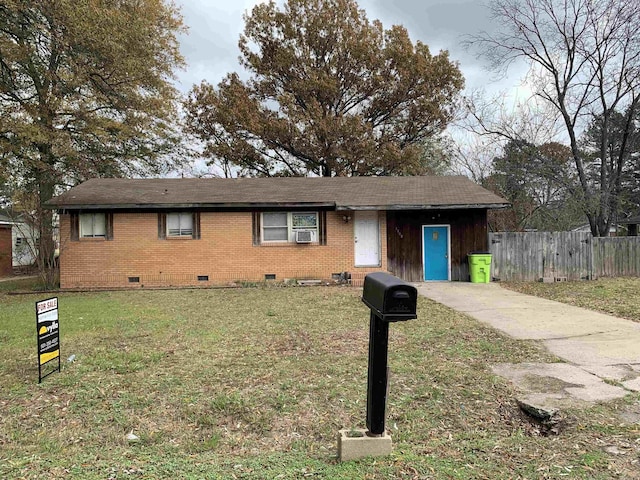 single story home with a front lawn