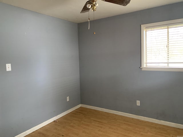 empty room featuring ceiling fan and light wood-type flooring