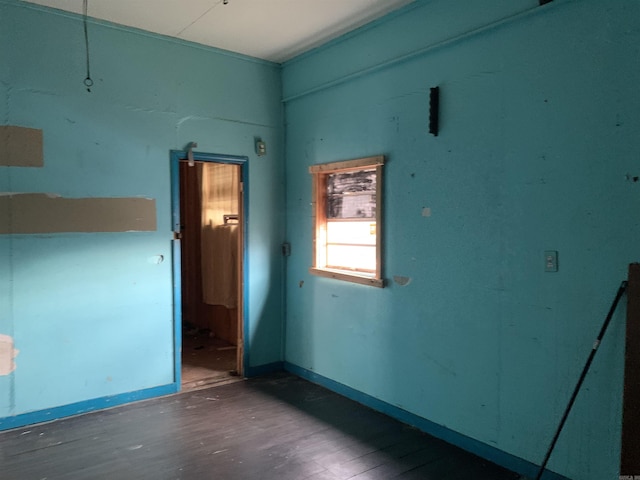 unfurnished room featuring wood-type flooring