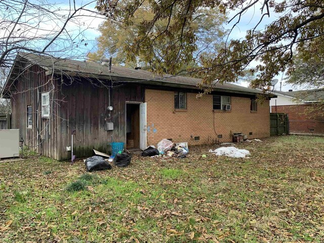 rear view of house featuring cooling unit