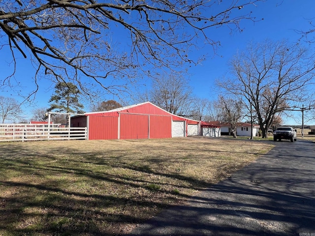 view of outdoor structure with a lawn