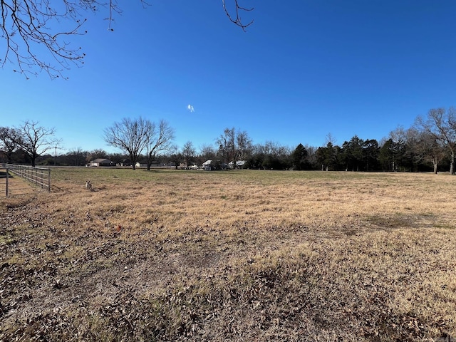 view of yard with a rural view