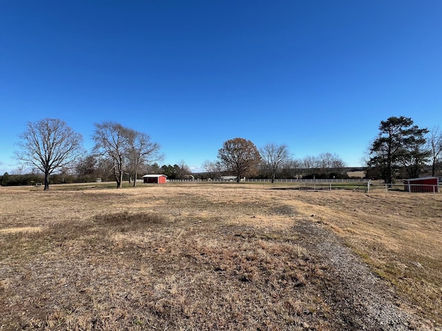 view of yard with a rural view