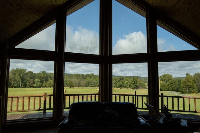 sunroom / solarium featuring wooden ceiling and vaulted ceiling