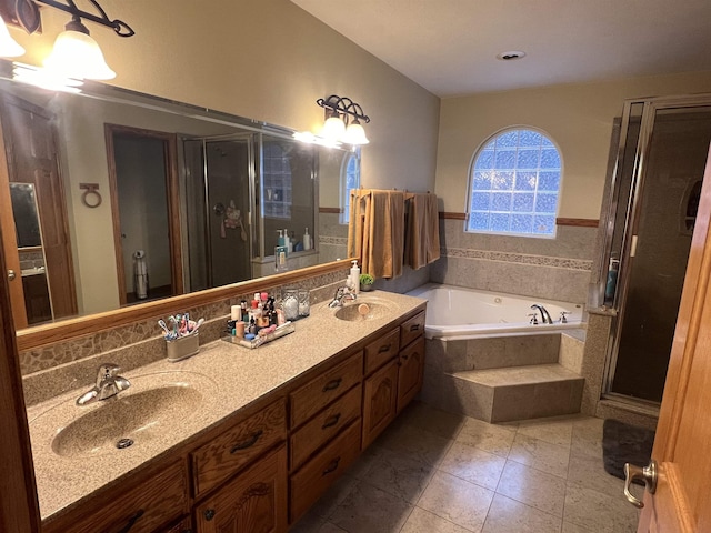 bathroom featuring vanity, independent shower and bath, and tile patterned flooring