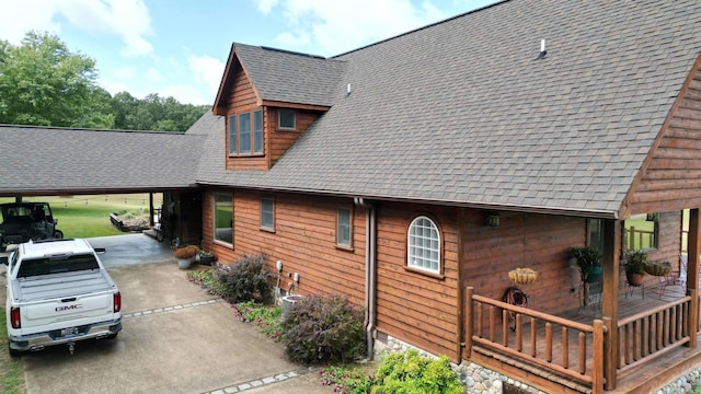 view of side of property with a carport