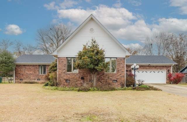 view of front of home with a garage and a front lawn