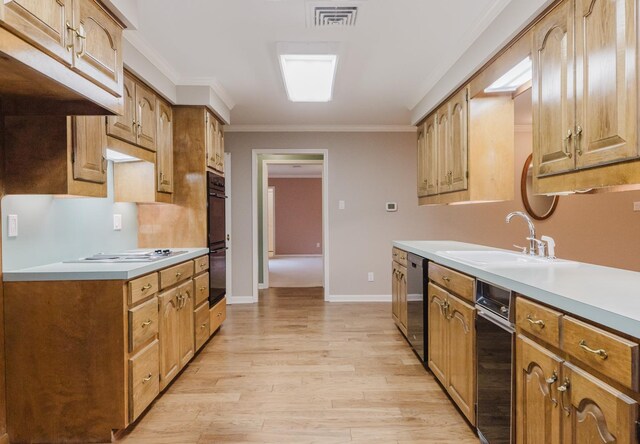 kitchen featuring sink, white electric cooktop, dishwasher, crown molding, and double oven