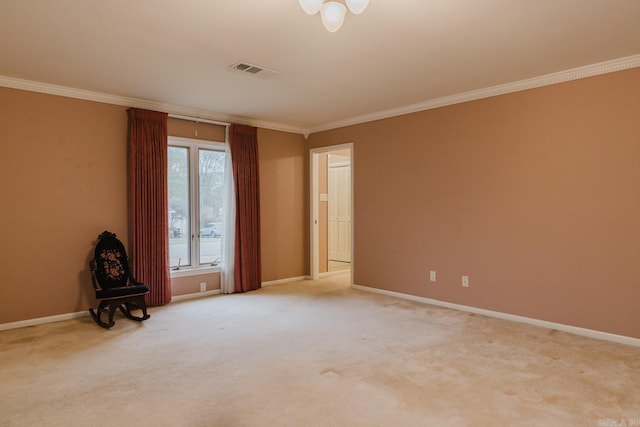 spare room with light carpet and crown molding