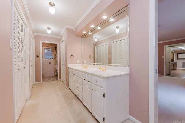 bathroom featuring ornamental molding and vanity