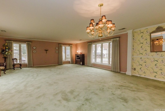 unfurnished living room with carpet floors, ornamental molding, a chandelier, and a healthy amount of sunlight