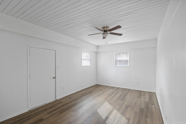 spare room with ceiling fan and wood-type flooring