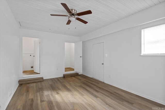 unfurnished room featuring hardwood / wood-style flooring and ceiling fan