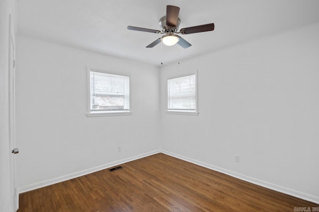 empty room featuring ceiling fan and hardwood / wood-style flooring