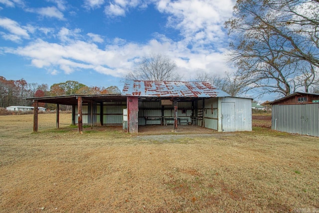 view of outdoor structure with a lawn