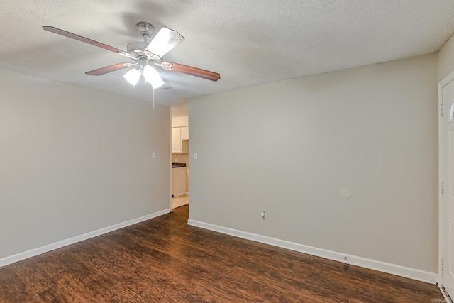 spare room with a textured ceiling, dark hardwood / wood-style floors, and ceiling fan