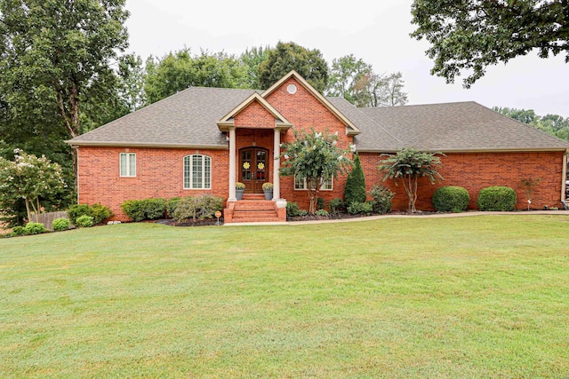 view of front of house featuring french doors and a front yard