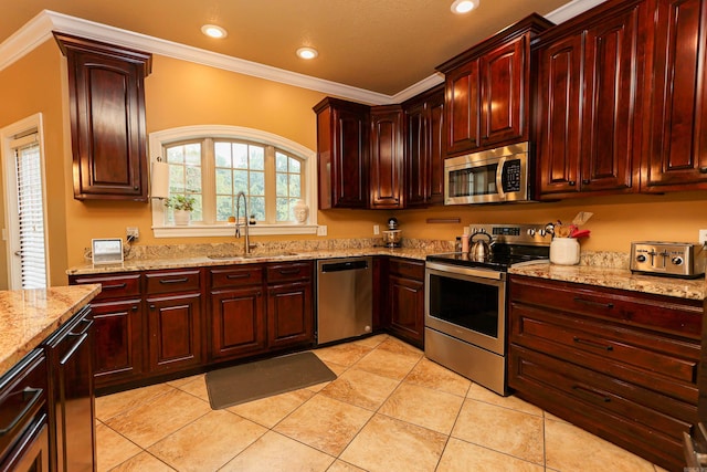 kitchen with light tile patterned flooring, sink, light stone counters, crown molding, and stainless steel appliances