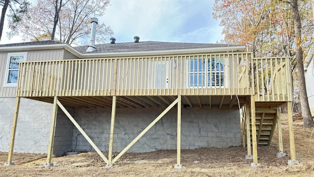 rear view of house with a wooden deck