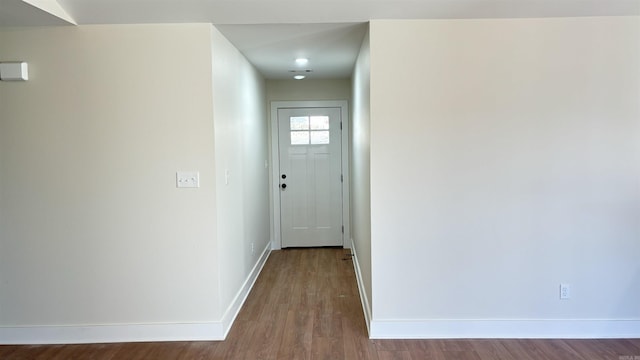 hallway featuring wood-type flooring