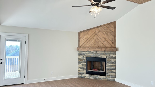 unfurnished living room featuring a fireplace, hardwood / wood-style floors, ceiling fan, and lofted ceiling