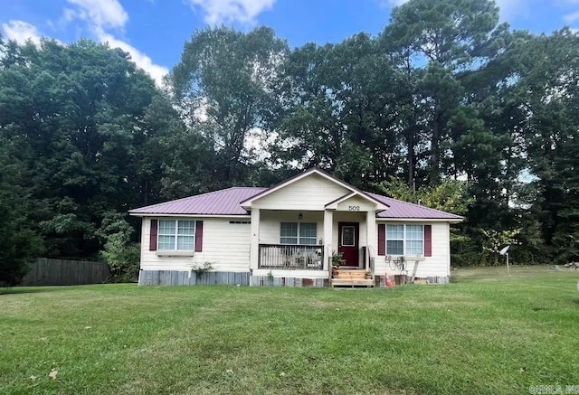 view of front of home featuring covered porch and a front yard