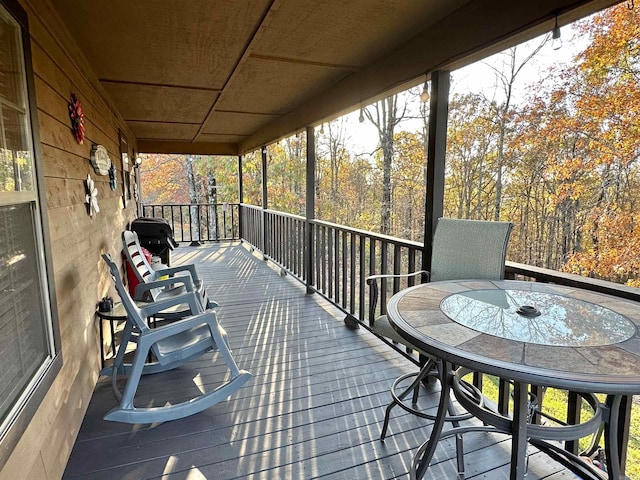 wooden terrace with area for grilling