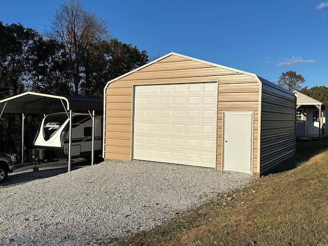 garage featuring a carport