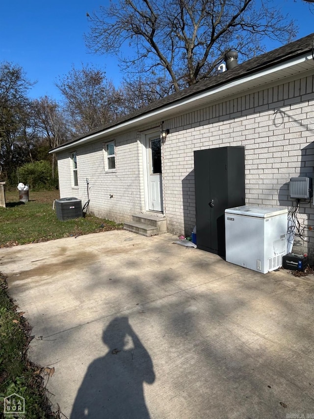 exterior space with a patio and central AC