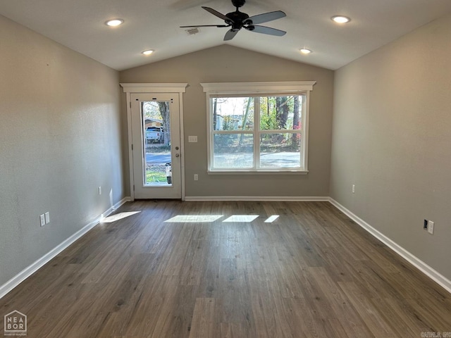 unfurnished room featuring ceiling fan, dark hardwood / wood-style flooring, and lofted ceiling