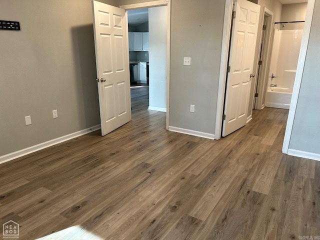 spare room with dark hardwood / wood-style floors