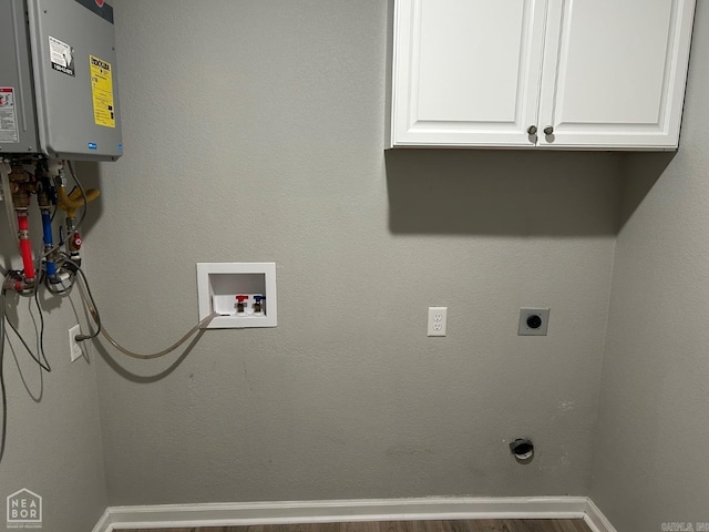 laundry room featuring cabinets, wood-type flooring, electric dryer hookup, and washer hookup