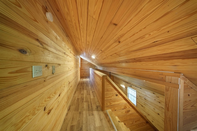 bonus room with wooden walls, wood ceiling, and hardwood / wood-style flooring